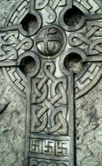 Celtic cross with swastikas at the base